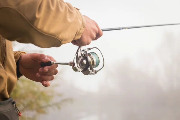 Pescador con spinning — Foto de Stock