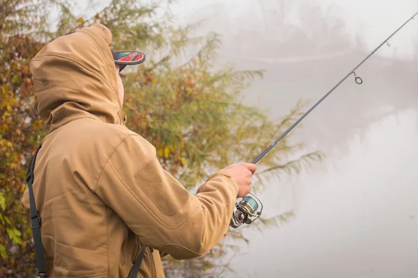 Fisherman with spinning — Stock Photo, Image