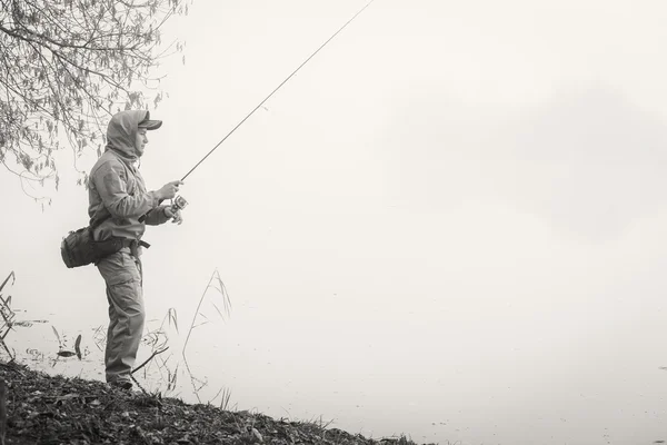 Fisherman with spinning — Stock Photo, Image