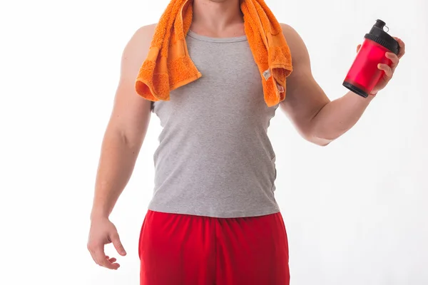 Bodybuilder holding a shaker for drinks — Stock Photo, Image