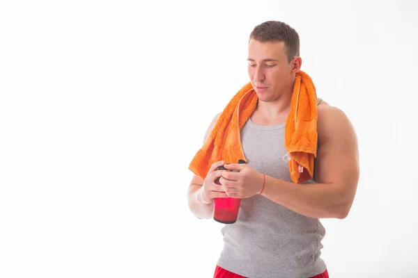 Bodybuilder holding a shaker for drinks — Stock Photo, Image