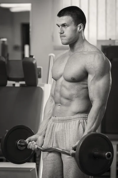 Man doing rise of the bar — Stock Photo, Image