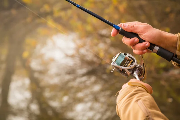 Pescador con spinning — Foto de Stock