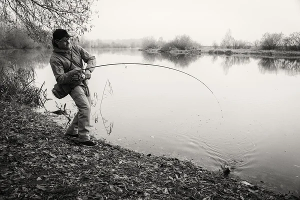 Pescador con spinning — Foto de Stock