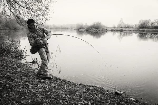 Pescador con spinning — Foto de Stock