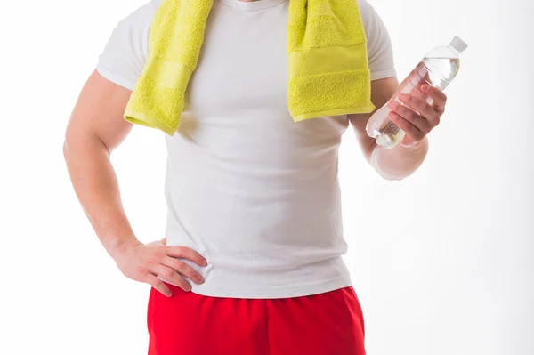 Bodybuilder with bottle of water — Stock Photo, Image