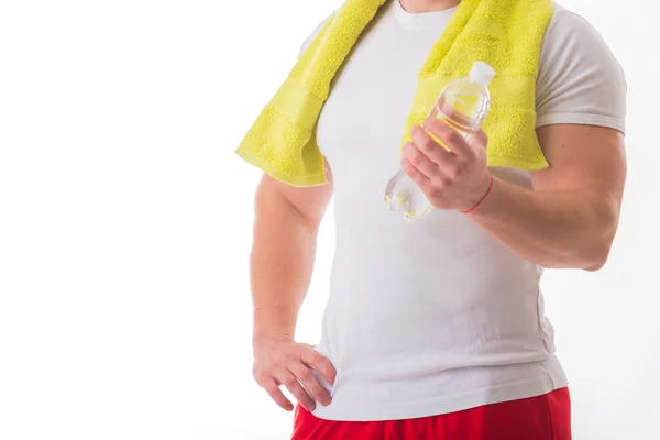 Bodybuilder with bottle of water — Stock Photo, Image