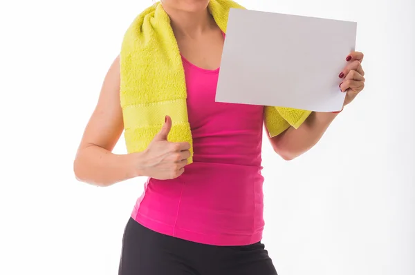 Sporty girl holding sheet of paper — Stock Photo, Image