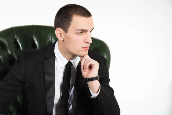 Male businessman sitting on leather chair — Stock Photo, Image