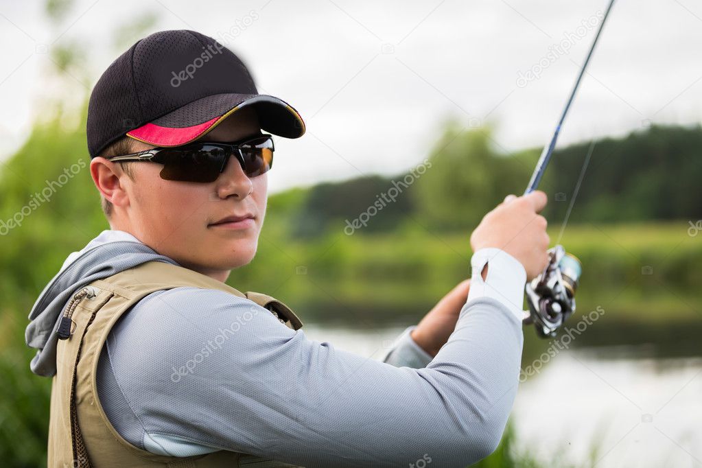 Fisherman on the river bank