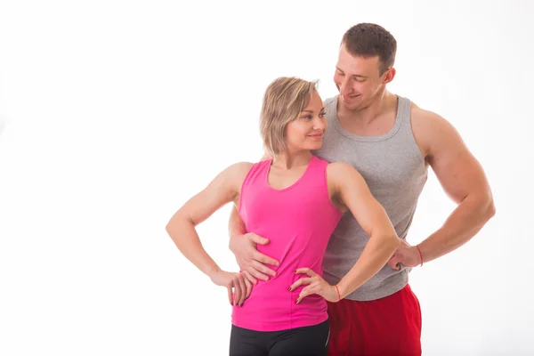 Athletic couple in sportswear — Stock Photo, Image