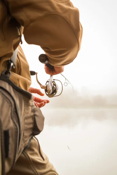 Pescador con spinning — Foto de Stock