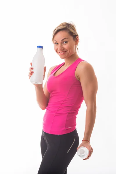 Girl athlete holding a bottle of water — Stock Photo, Image