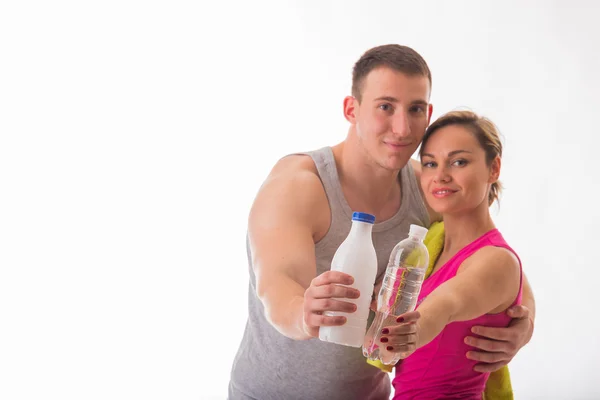 Muž a žena s mlékem a vodou — Stock fotografie