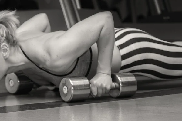 Girl with dumbbells — Stock Photo, Image