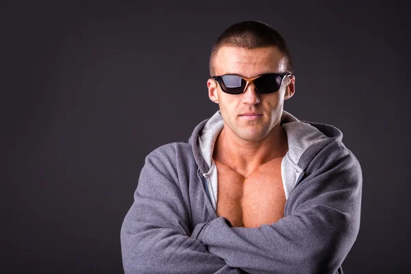 Man in a sports jacket and sunglasses — Stock Photo, Image