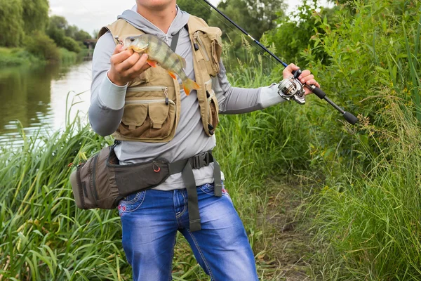 Fisherman on the river bank — Stock Photo, Image