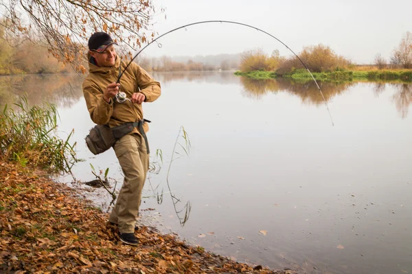 Fisherman with spinning — Stock Photo, Image