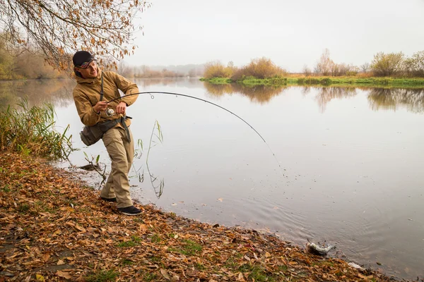 Fisherman with spinning — Stock Photo, Image