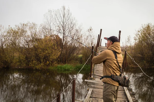 Fisherman with spinning — Stock Photo, Image