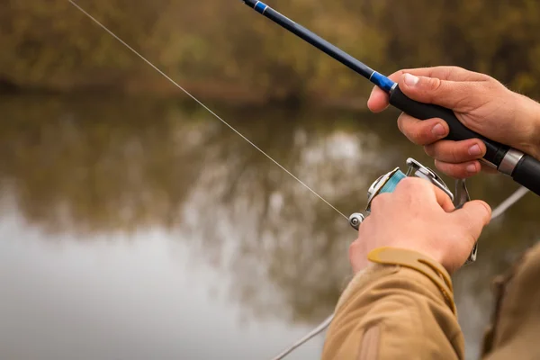 Pescador con spinning — Foto de Stock