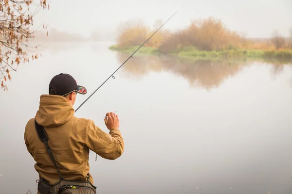 Fisherman with spinning — Stock Photo, Image