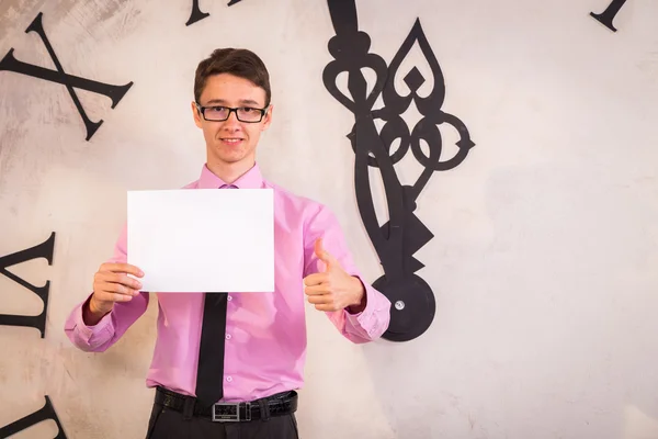 Young man near clock — Stock Photo, Image