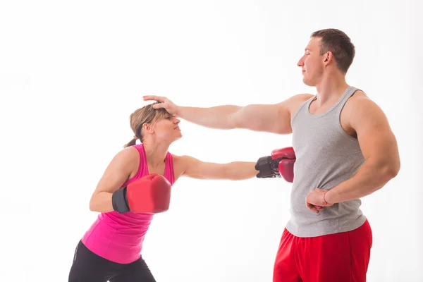 Sporty man and woman fighting — Stock Photo, Image