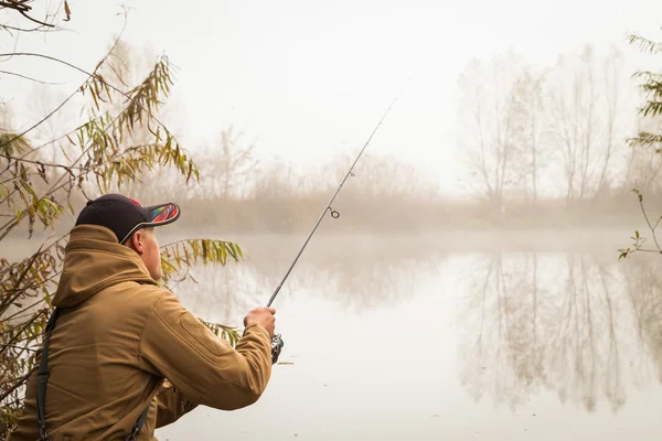 Fisherman with spinning — Stock Photo, Image