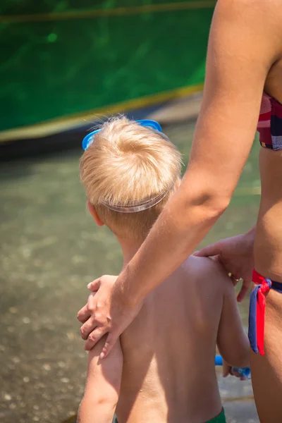 Blond boy near water — Stock Photo, Image