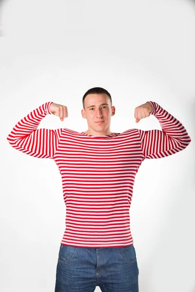 Homem musculoso em uma roupa listrada — Fotografia de Stock