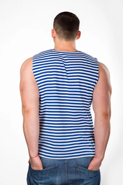 Muscular man in a striped clothes — Stock Photo, Image