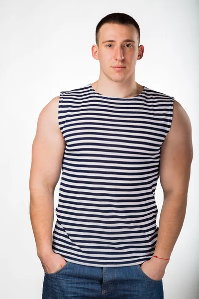 Muscular man in a striped clothes — Stock Photo, Image