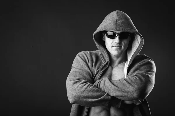 Man in a sports jacket and sunglasses — Stock Photo, Image
