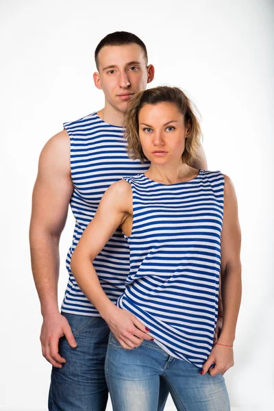 Athletic man and woman in striped vest — Stock Photo, Image