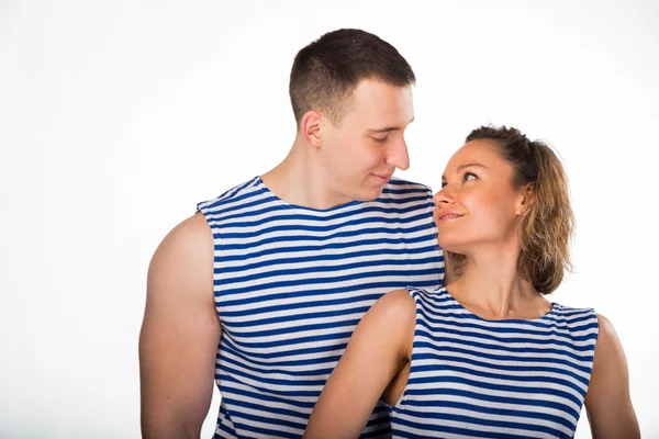 Athletic man and woman in striped vest — Stock Photo, Image