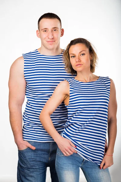 Homem e mulher atléticos em colete listrado — Fotografia de Stock