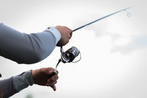 Fisherman with spinning closeup — Stock Photo, Image