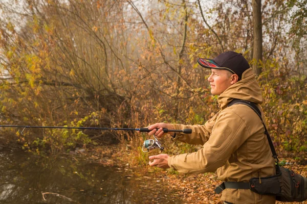 Fisherman on the autumn background. — Stock Photo, Image