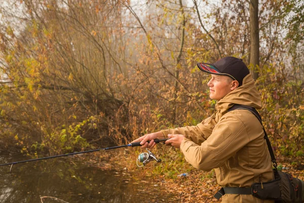 Fisherman on the autumn background. — Stock Photo, Image