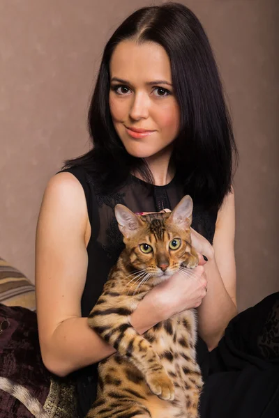 Girl with a bengal cat.