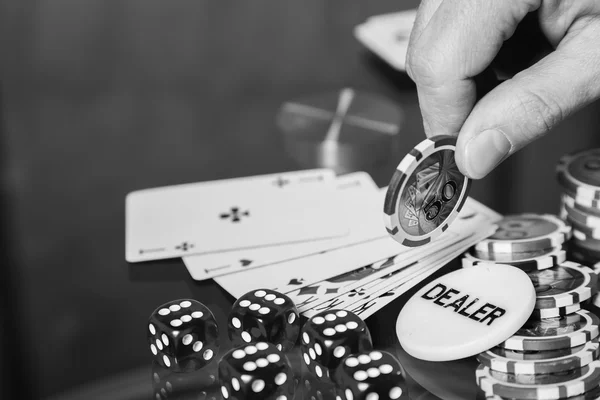 Poker chips and cards on a glass table — Stock Photo, Image