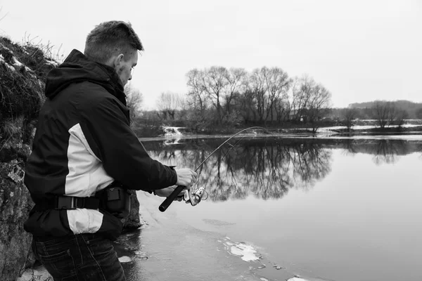 Fisherman on the river bank — Stock Photo, Image