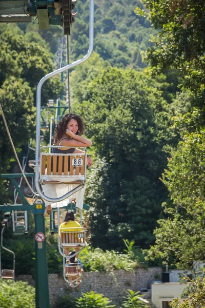 Woman in ropeway cabin — Stock Photo, Image