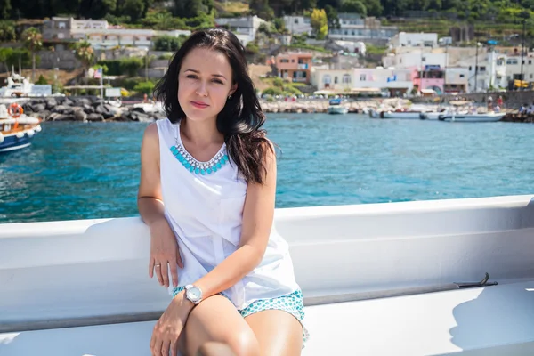 Brunette  woman on a yacht sailing — Stock Photo, Image