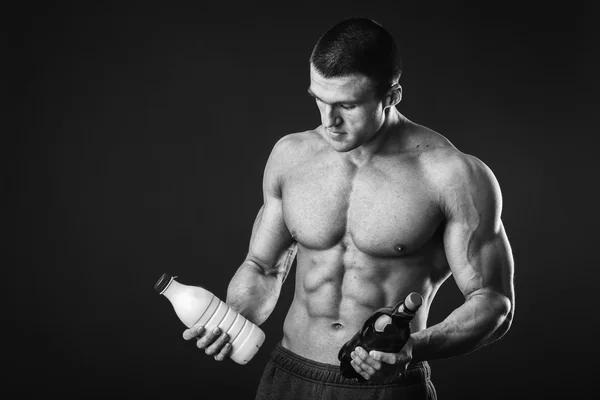 Man holding a beer and milk — Stock Photo, Image