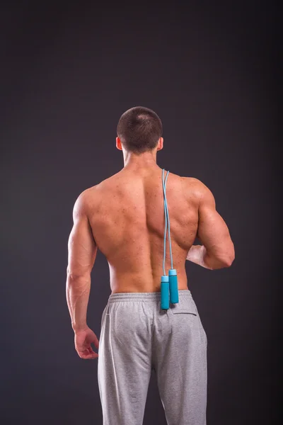 Strong  man with a skipping-rope — Stock Photo, Image