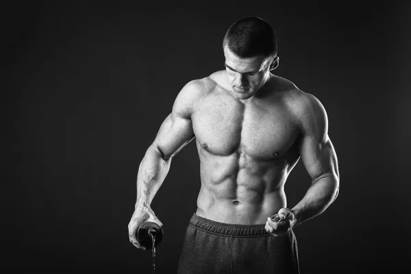 Muscular guy with a beer — Stock Photo, Image