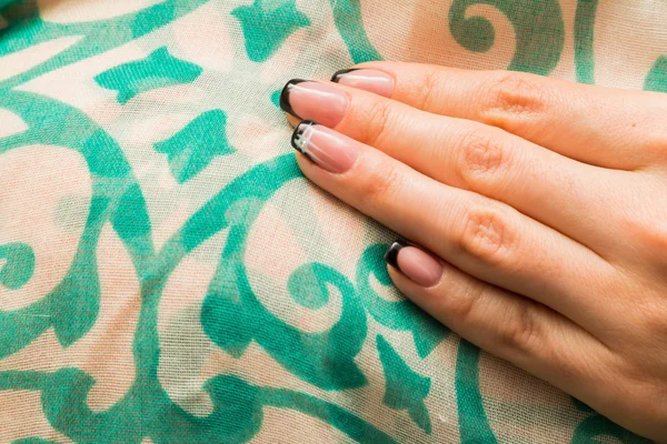 Female hands with painted nails. — Stock fotografie