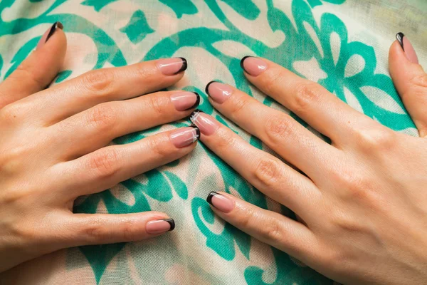 female hands with painted nails.